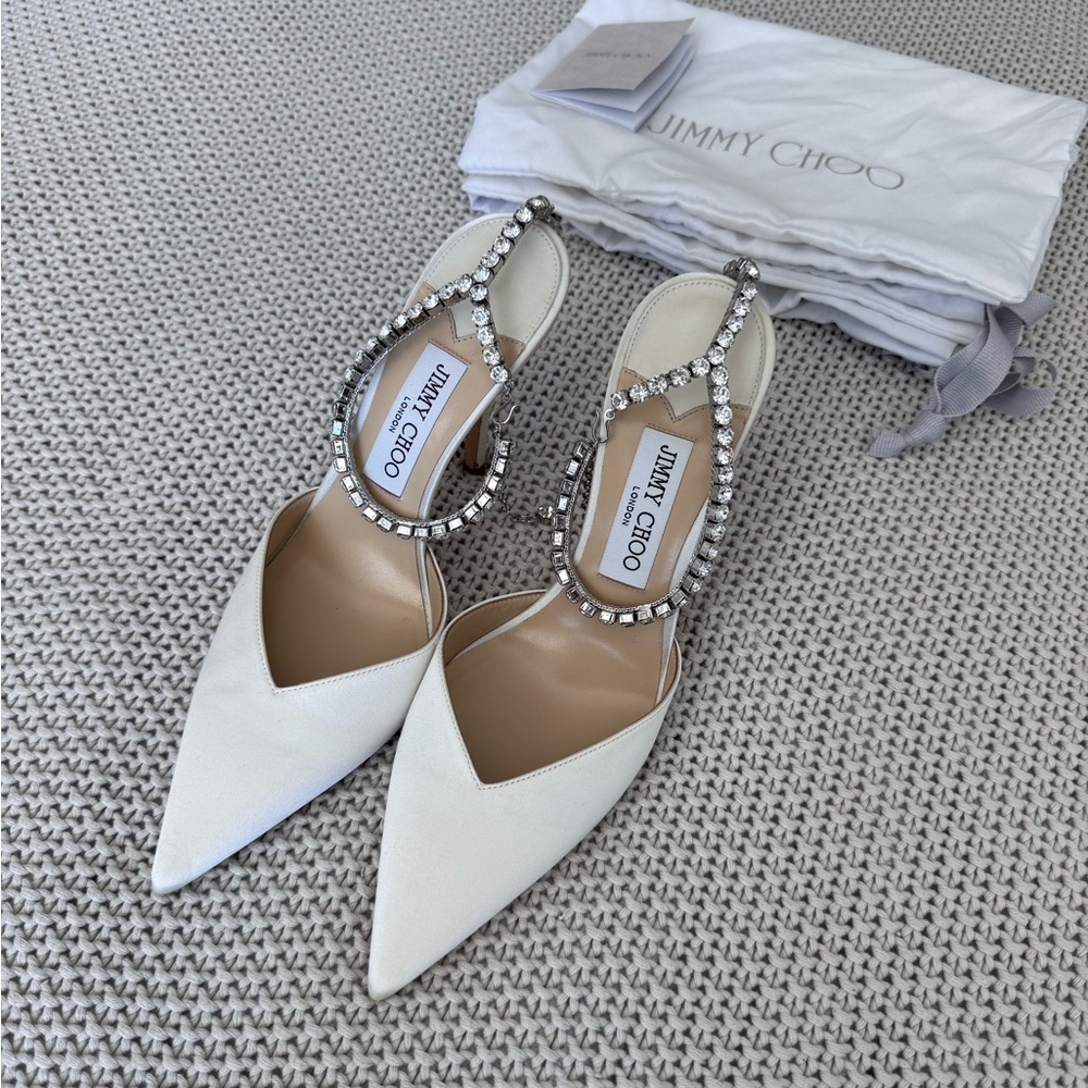 Jimmy Choo Saeda 100 
Ivory Satin Pumps with Crystal Embellishment